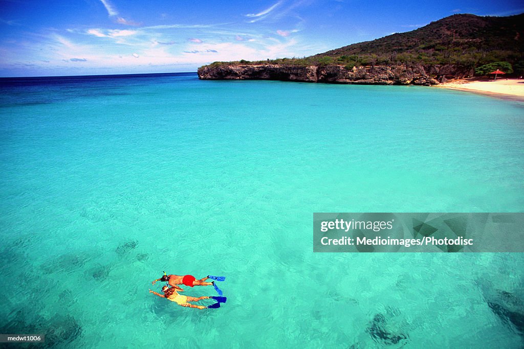 Couple snorkeling in crystal clear water off Knip Beach in Curacao