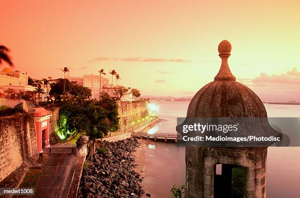 view of paseo de la princesa at sunset in san juan, puerto rico - puerto stock pictures, royalty-free photos & images