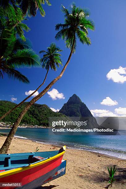 boat on beach near pitons at souffriere, saint lucia, caribbean - saint lucia stockfoto's en -beelden