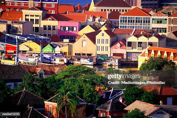 colorful buildings on willemstad waterfront, curacao, caribbean - willemstad stock pictures, royalty-free photos & images