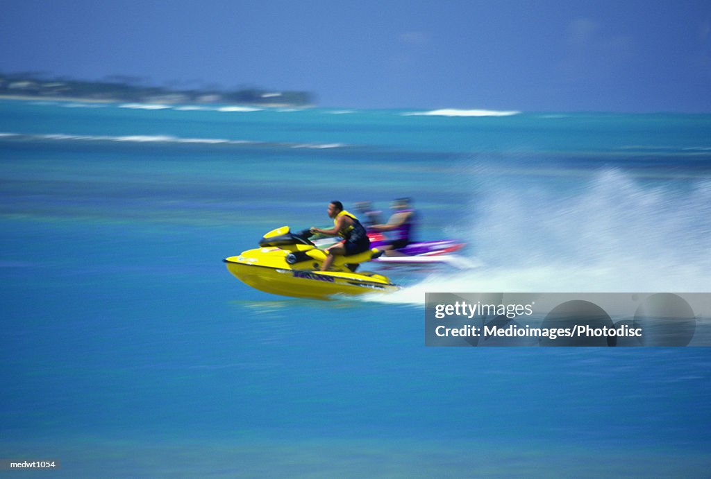 People on wave runners near Luquillo Beach, Puerto Rico, selective focus