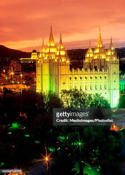night view of the mormon temple of the church of latter day saints in salt lake city, utah - latter stock pictures, royalty-free photos & images