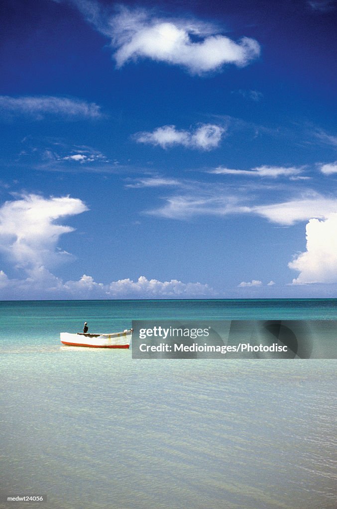 Person in boat off Turner's Beach on Antigua, Caribbean