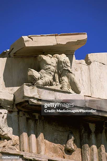 detail of the parthenon, the main temple on the acropolis at athens, greece, extreme close-up - zentralgriechenland stock-fotos und bilder