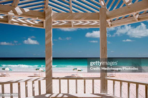 caribbean, st. martin, orient beach, lounge chairs and umbrellas on a beach - travel16 ストックフォトと画像