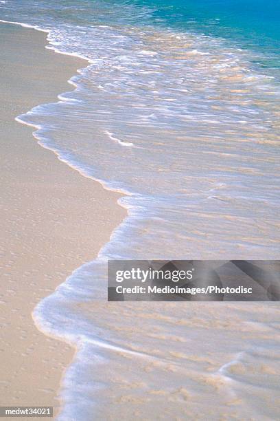 caribbean, turks and caicos islands, providenciales, grace bay beach, high angle view of a tropical beach - bay islands stock pictures, royalty-free photos & images