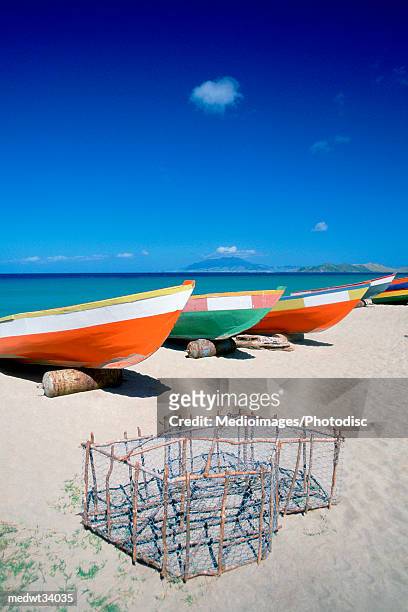 caribbean, nevis, pinneys beach, fishing boat on a beach - névis imagens e fotografias de stock