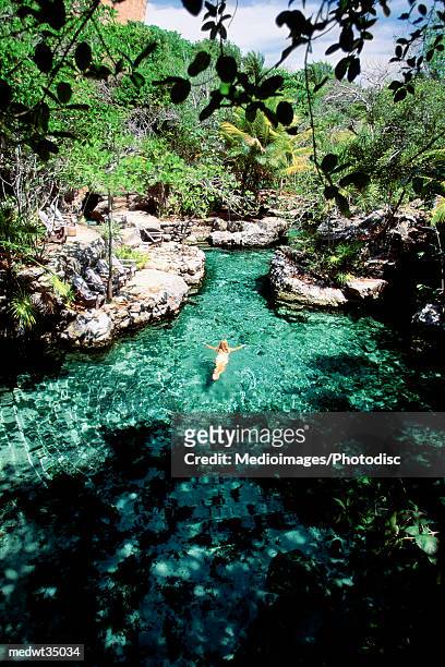mexico, xcaret, woman swimming in the river - travel16 ストックフォトと画像