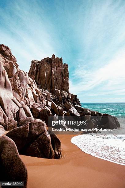 mexico, baja california, cabo san lucas, waves crashing on solmar beach - cabo stock pictures, royalty-free photos & images