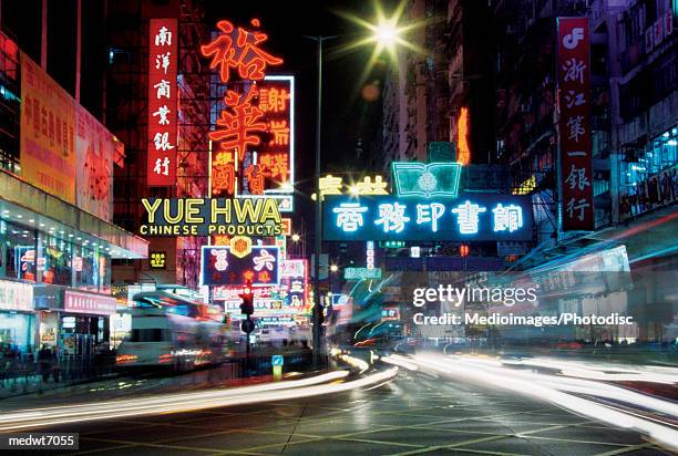 city lights of hong kong at night, china, selective focus, blurred motion - south east china stock pictures, royalty-free photos & images