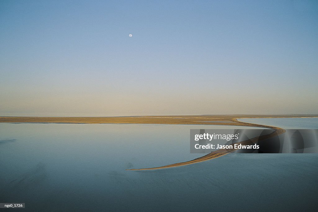 Scenic view of a moonrise over a placid body of water