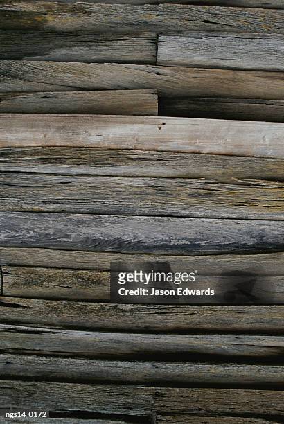 close view of slats on an antique timber barn. - antique stockfoto's en -beelden
