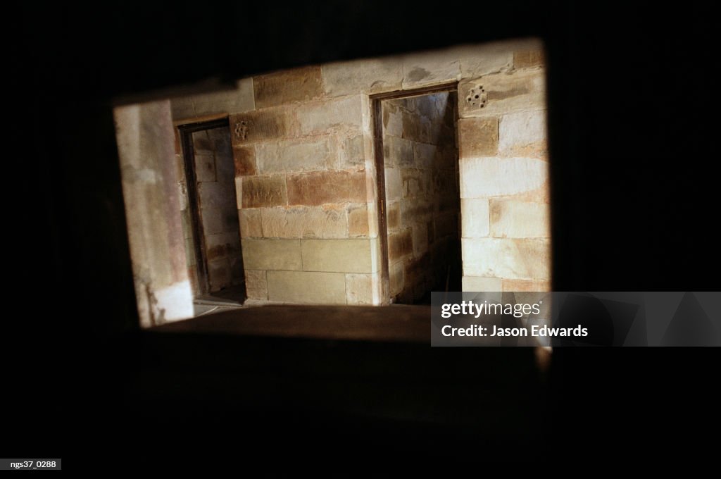 Port Arthur Penal Settlement, Tasmania, Australia. A view through the food tray slot in a prison cell door.