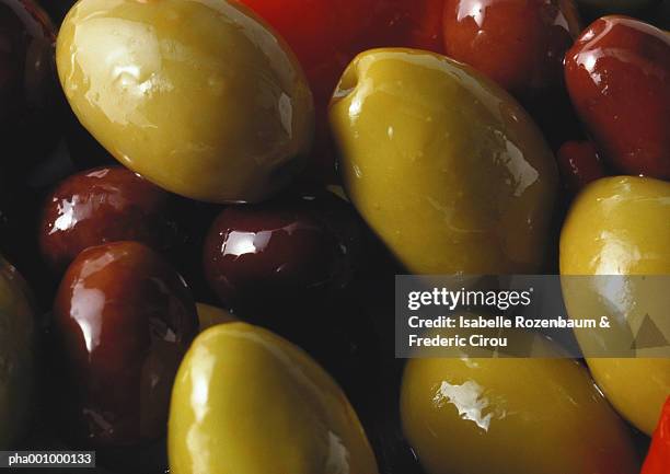 green and black olives, close-up - black olive stock pictures, royalty-free photos & images