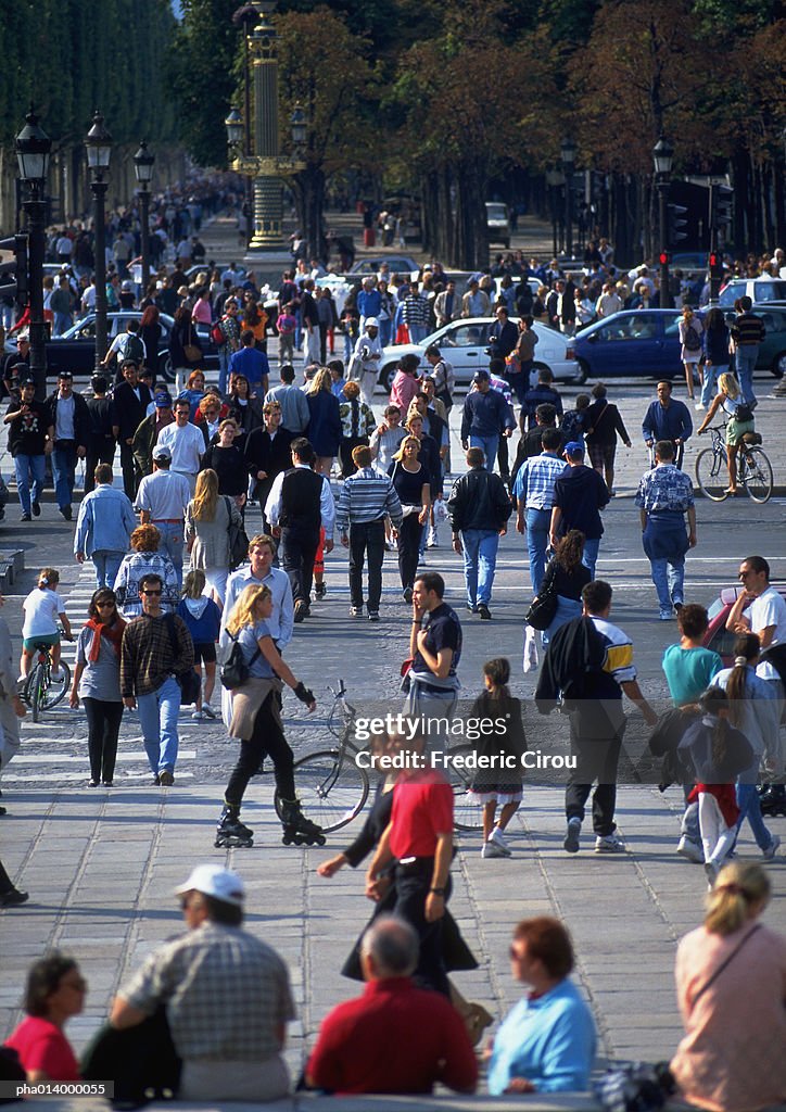 Crowd crossing street, blurred.