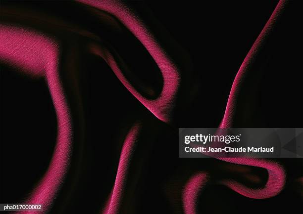 folds in red fabric, close-up, full frame - wall hanging stock pictures, royalty-free photos & images