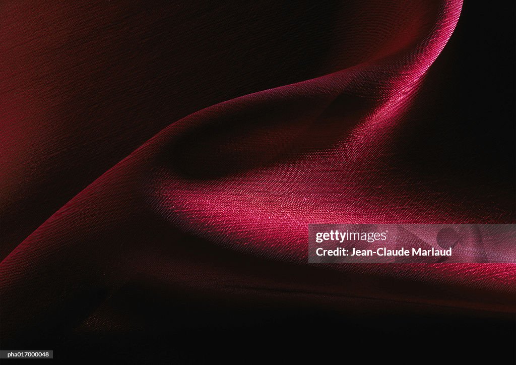 Fold in crimson satin, close-up