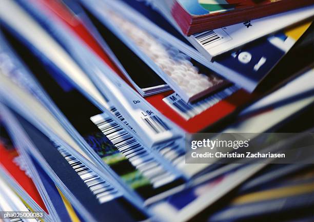 disorderly stack of magazines, extreme close-up on corners with barcodes, full frame - magazine photos et images de collection