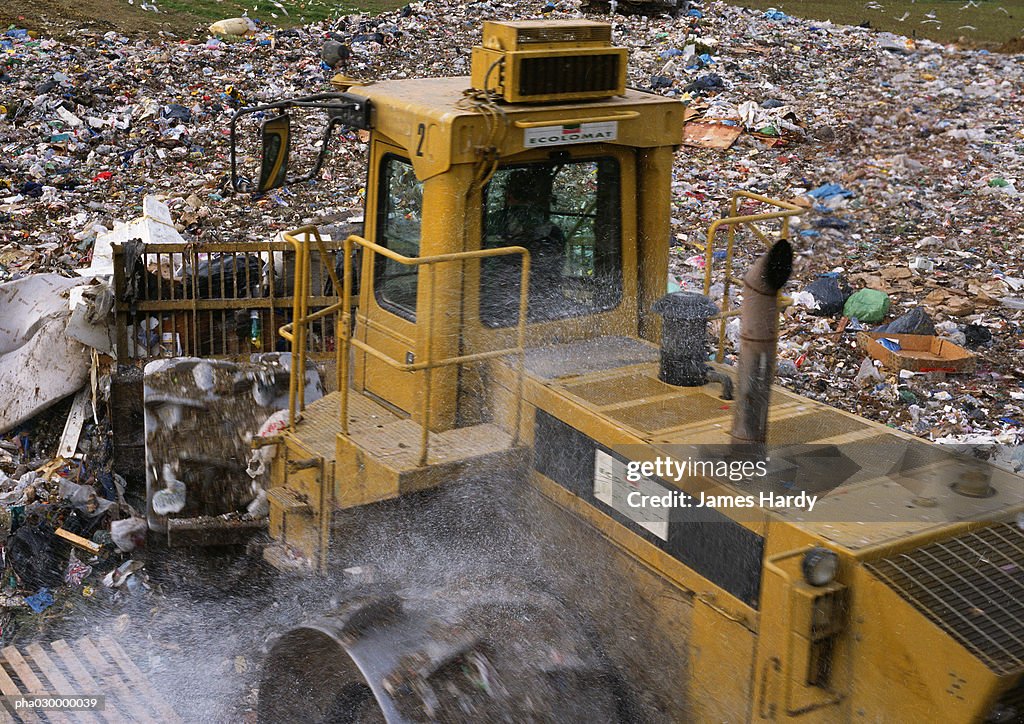 Bulldozer in trash dump