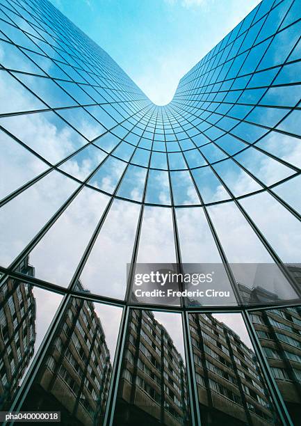 building reflected in skyscraper's facade, low angle view - evighet bildbanksfoton och bilder