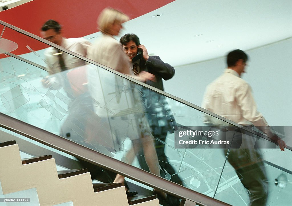 Business people on stairs, blurred