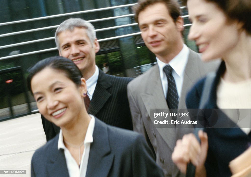 Group of business people walking, blurred