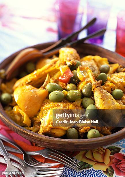 chicken tagine, with green olives, in bowl, close-up - tajine fotografías e imágenes de stock