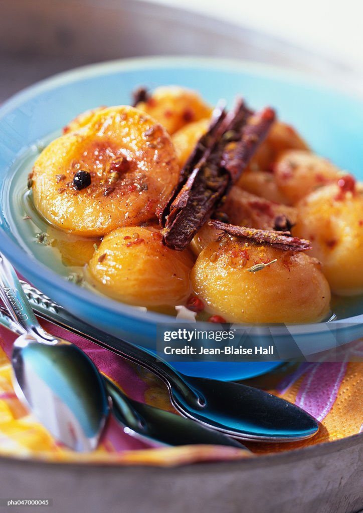 Bowl of apricots with spices, close-up