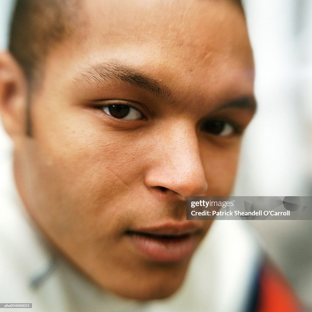 Portrait of male teenager looking into camera