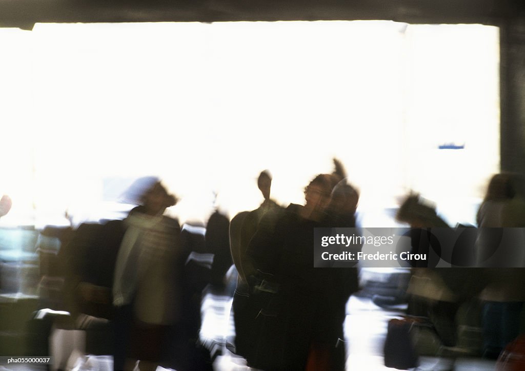 Silhouettes of people, blurred