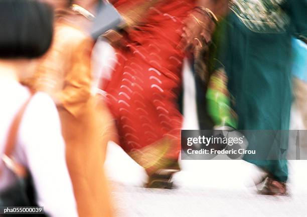 people walking in street, low section, blurred - africain stockfoto's en -beelden