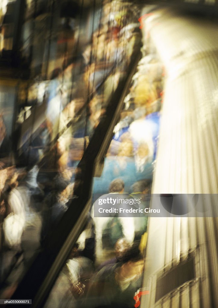 Crowd on subway platform, high angle view, blurred