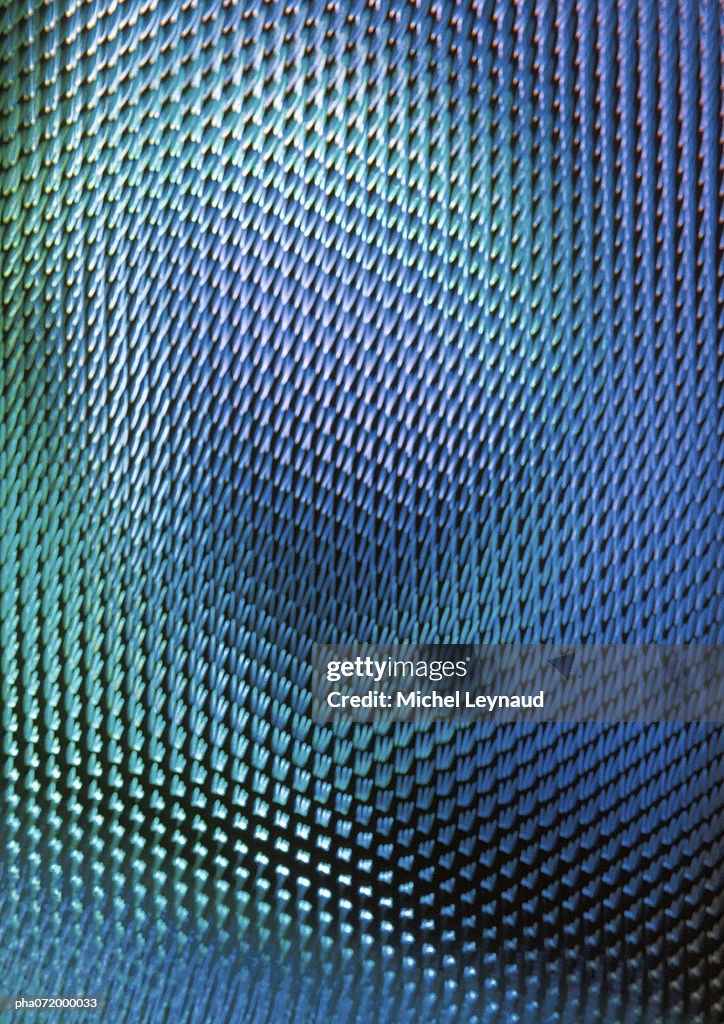 Light effect on textured surface, blues and greens, full frame