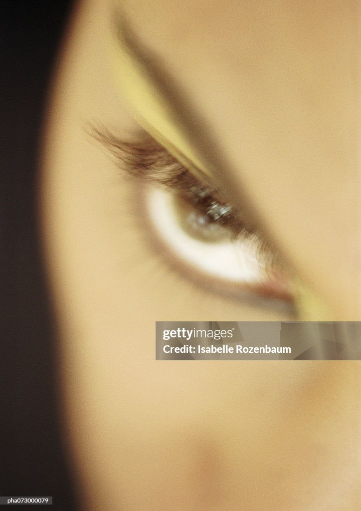 Woman's made-up eye, blurred close-up