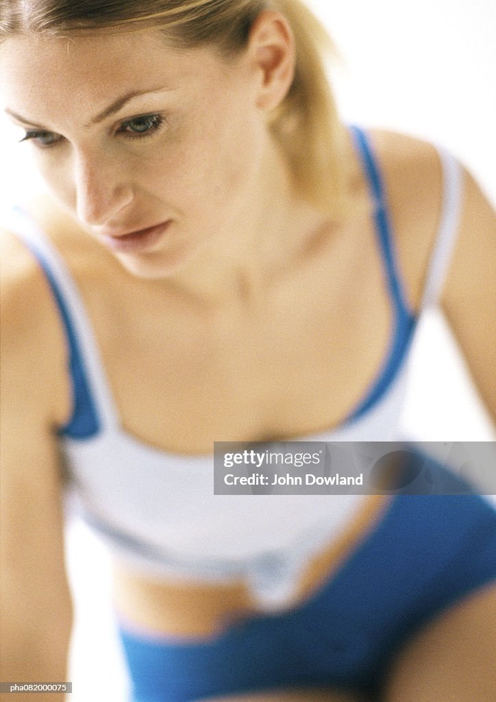 Woman in workout clothes, blurred