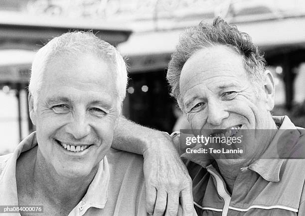 two senior men smiling, portrait, b&w. - old brother stock pictures, royalty-free photos & images