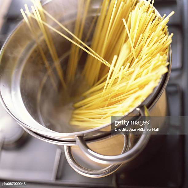 close-up of pasta in pot. - cooking pasta stock pictures, royalty-free photos & images