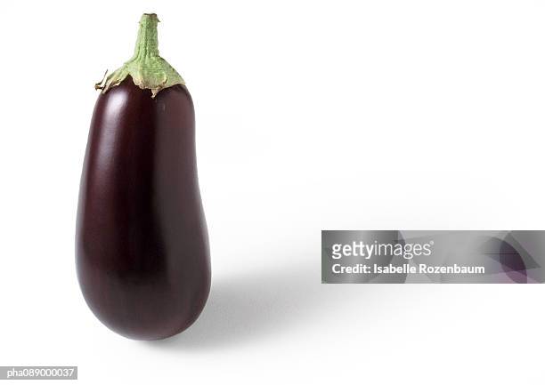 eggplant standing on end, close-up - aubergine stock-fotos und bilder