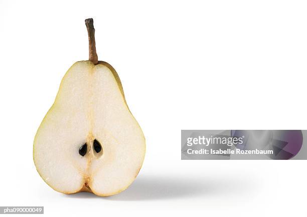 half a pear, white background - pear stock-fotos und bilder