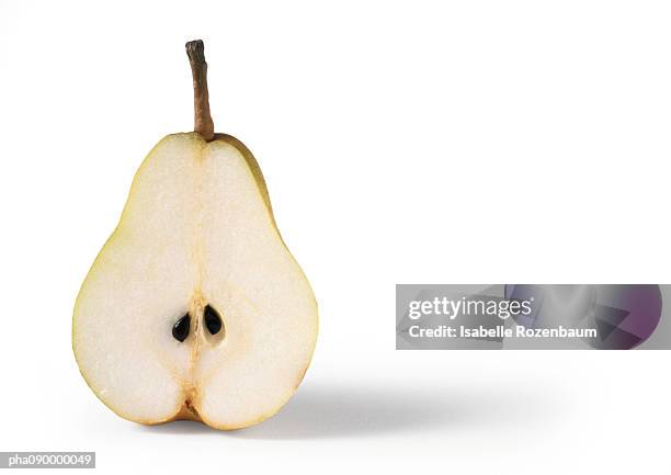 half a pear, white background - pera fotografías e imágenes de stock