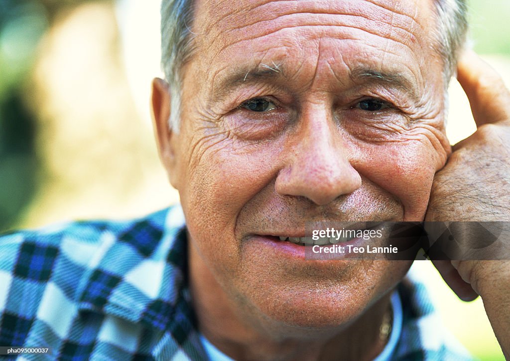 Mature man smiling, close-up, portrait