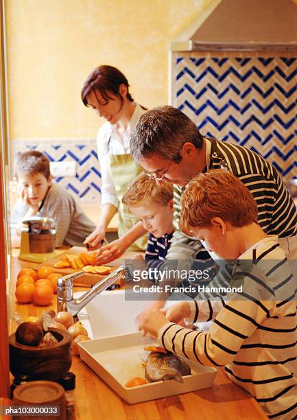 family cooking - 5 fishes stock pictures, royalty-free photos & images