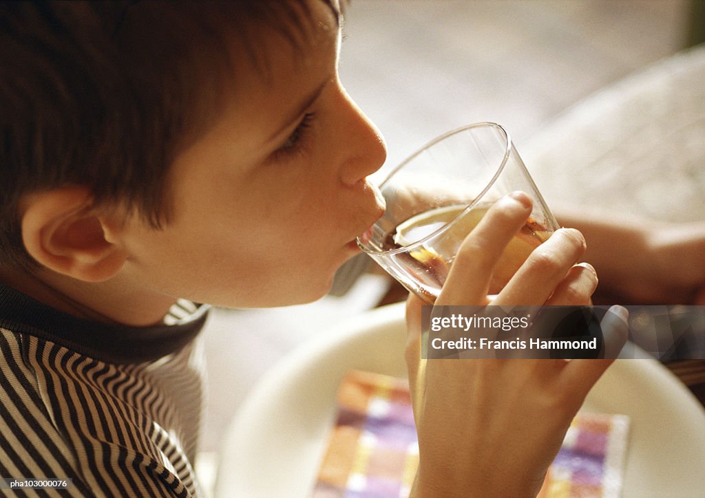 Child drinking, side view, close-up