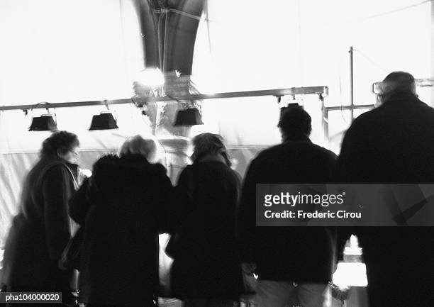 people standing side by side, rear view, b&w - intersected stock pictures, royalty-free photos & images