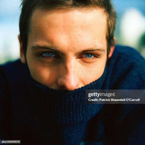 man wearing turtleneck - polo neck stock pictures, royalty-free photos & images