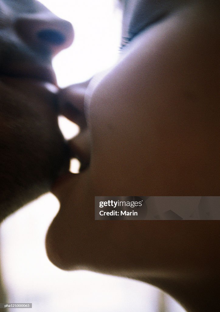 Couple kissing, close-up