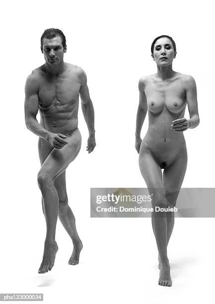 nude man and nude woman running side by side, frontal view, b&w - portrait frontal stock pictures, royalty-free photos & images