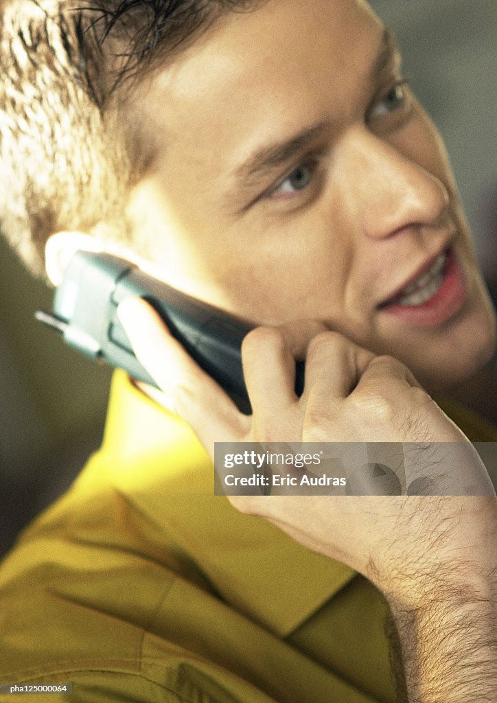 Man using cell phone, close-up