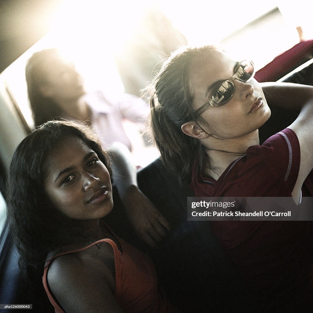Teenage girls looking into camera, portrait