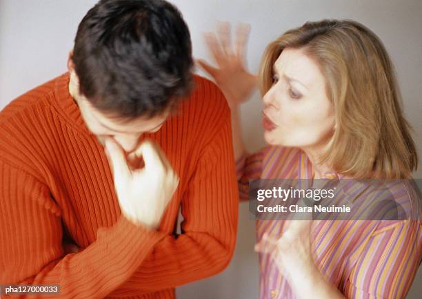 woman talking to man looking down - clara stock pictures, royalty-free photos & images